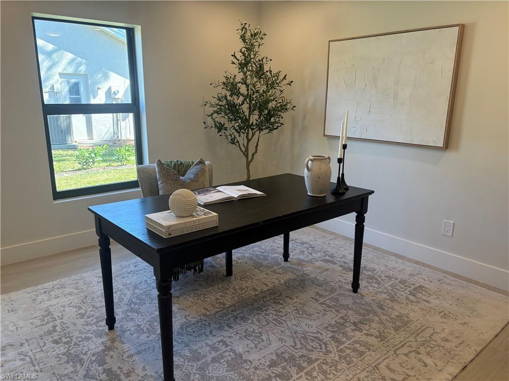 Office space featuring light wood-style flooring