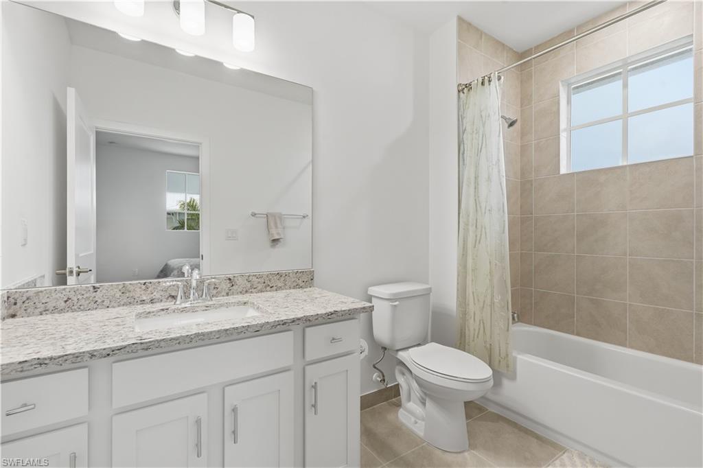 Guest ensuite bathroom with shower/tub combo.