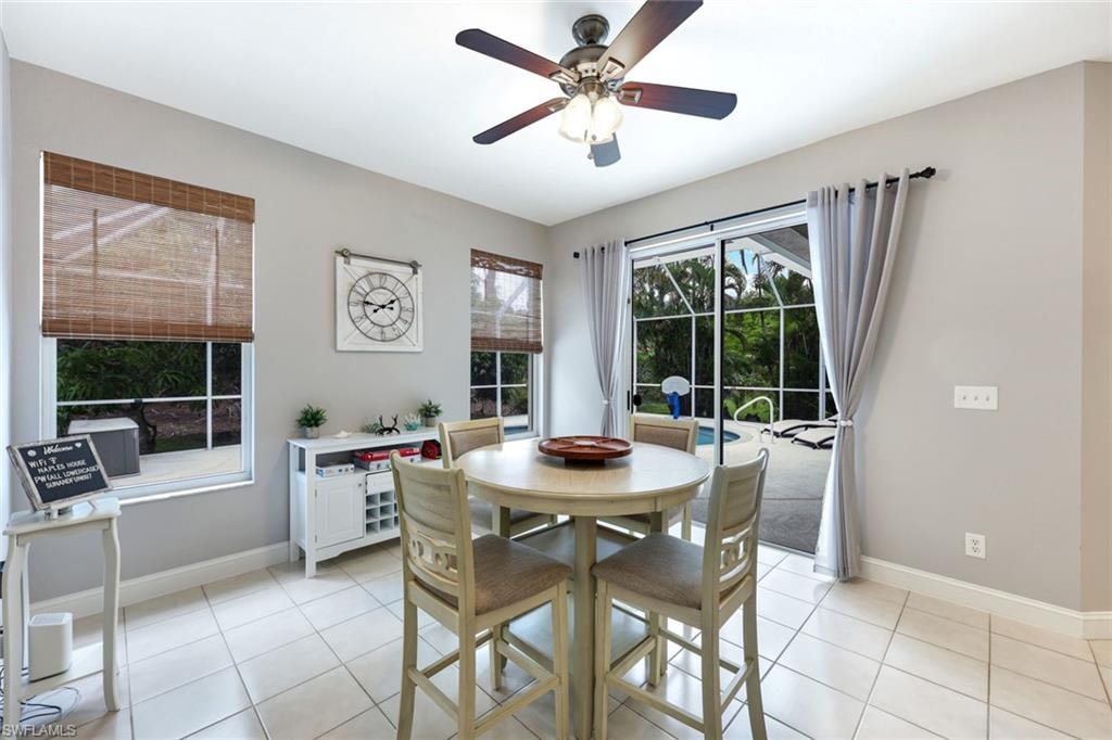 Dining room featuring ceiling fan and light tile patterned floors