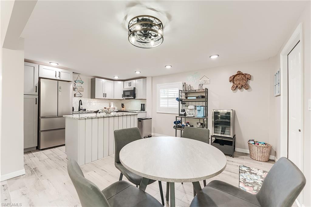 2nd Level Dining area with light wood-style flooring and recessed lighting- Virtually Edited Image
