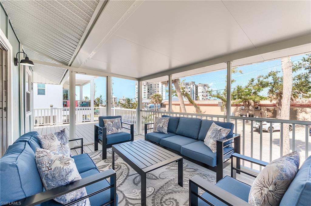 Sunroom / solarium with healthy amount of natural light and an outdoor hangout area- Virtually Edited Image
