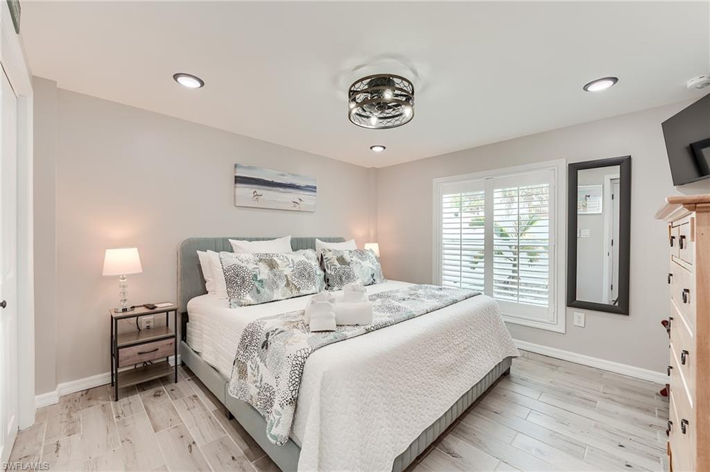 1st Floor Bedroom featuring light wood-type flooring and recessed lighting- Virtually Edited Image