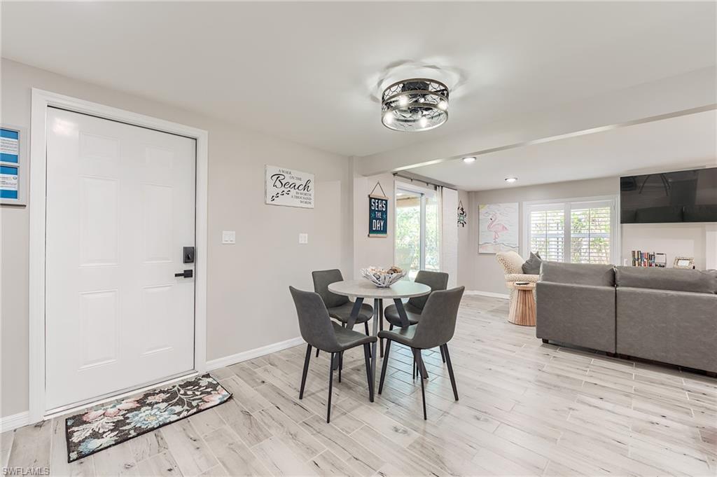 1st Floor Dining room featuring baseboards and light wood-style floors- Virtually Edited Image