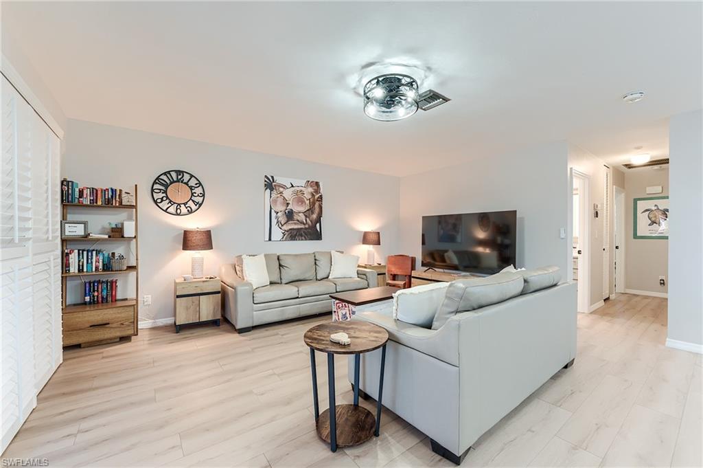 2nd Level Living room featuring baseboards and light wood-type flooring- Virtually Edited Image