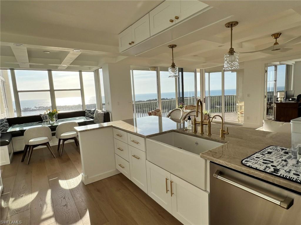 Kitchen island with farmhouse sink and brass fixtures