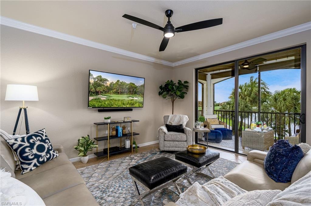 Spacious living area featuring neutral wall tones, crown molding, a ceiling fan with integrated lighting, and direct access to an enclosed lanai through sliding glass doors