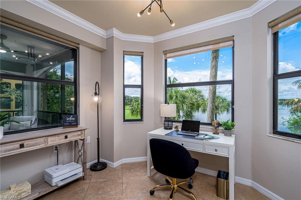 Dedicated room featuring multiple windows with roller shades, crown molding, and tiled flooring