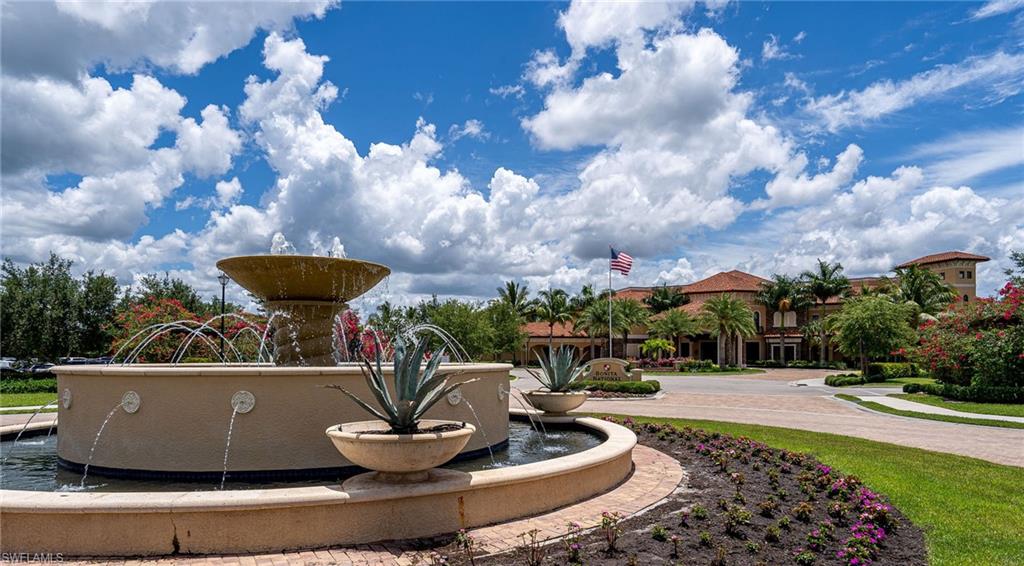 Two-tiered fountain with agave plantings greet guests