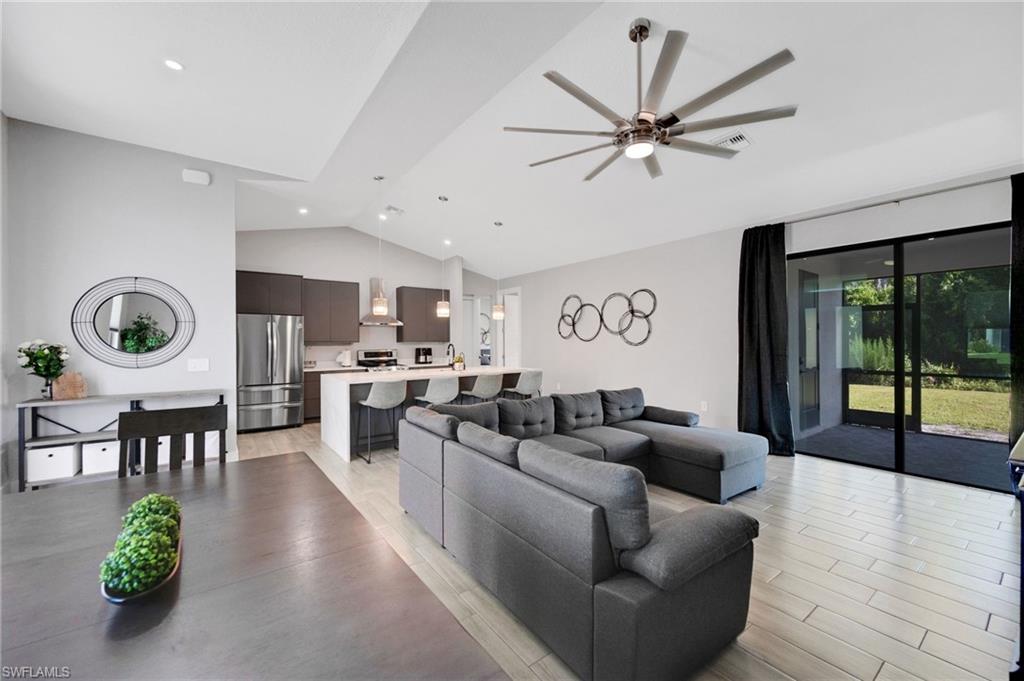 Vaulted ceilings with recessed lighting and a contemporary ceiling fan