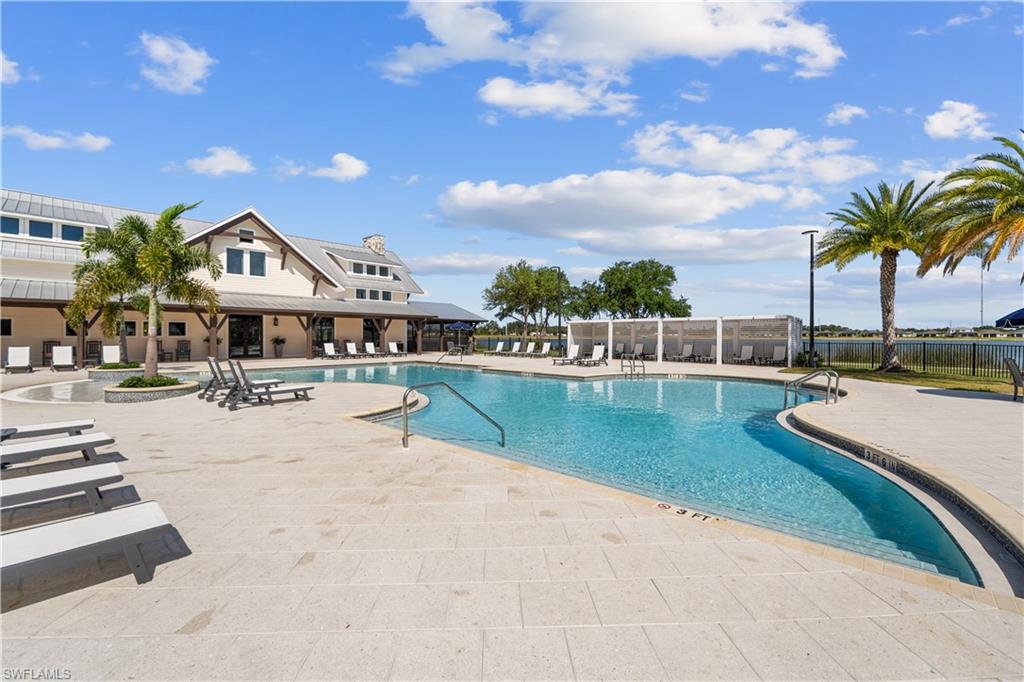 Expansive outdoor swimming pool with integrated spa