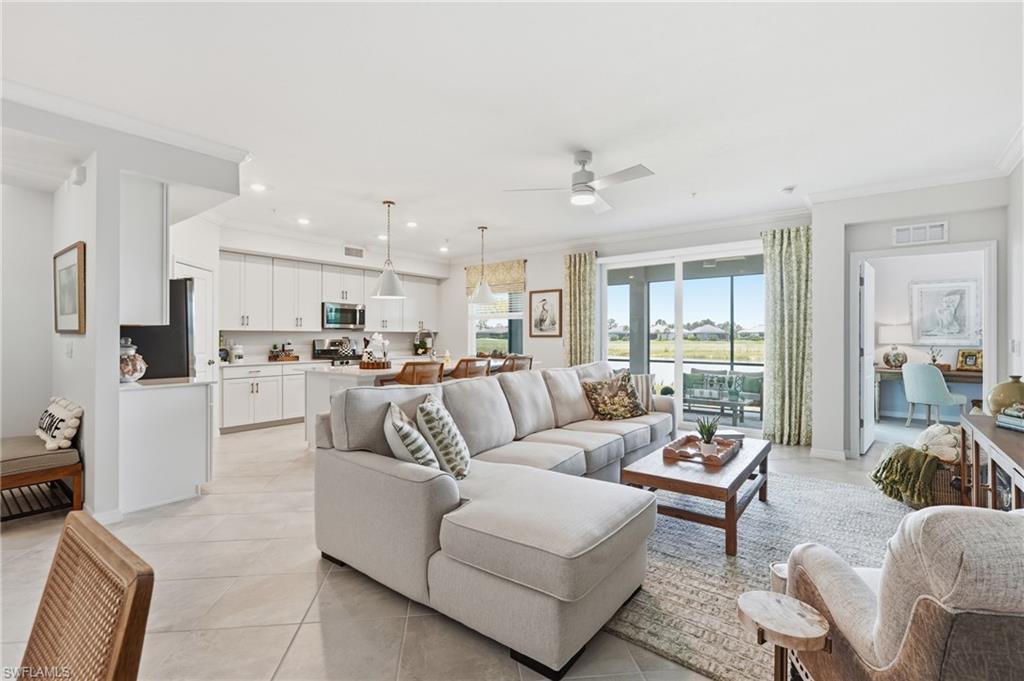 Open-concept living space featuring a spacious living room, kitchen, and dining area