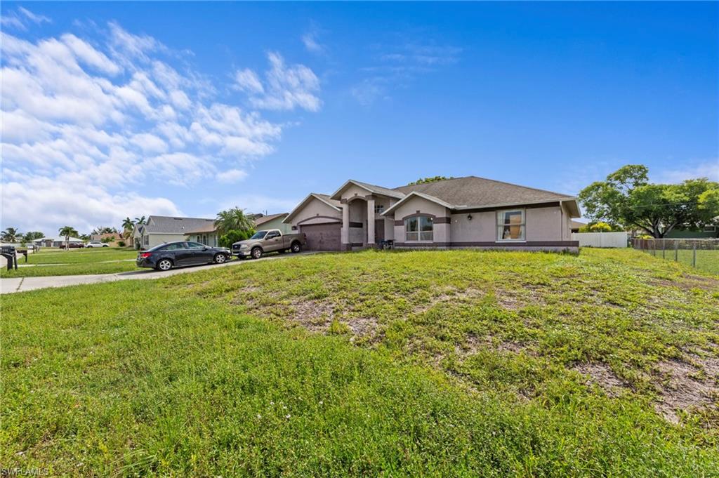 Contemporary single-story residence featuring a two-car garage and a gently sloped front yard