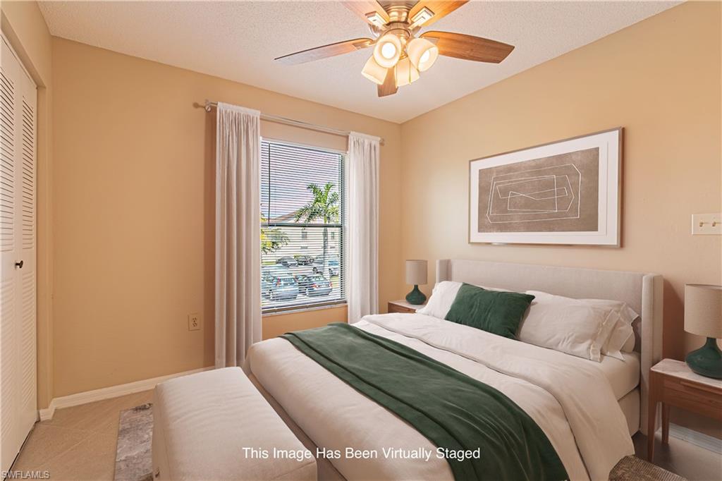 Guest bedroom with tiled flooring.