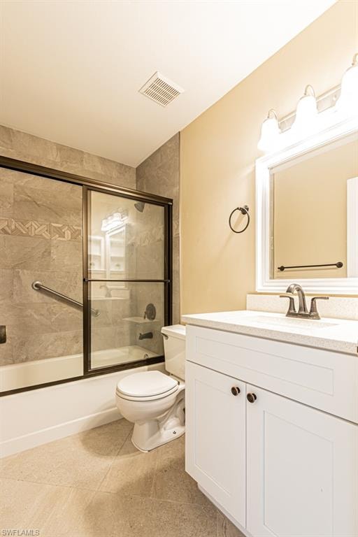 Sleek quartz vanity counter top. Updated cabinets and tiled floor