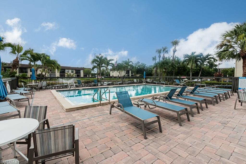 Outdoor swimming pool with integrated steps and a surrounding paver deck
