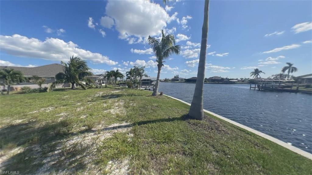 Left side from middle of seawall on OVERSIZE SOUTHERN rear Exposure Gulf Access lot with NEW (12/2021) 121' SEAWALL - BIG WATER VIEWS