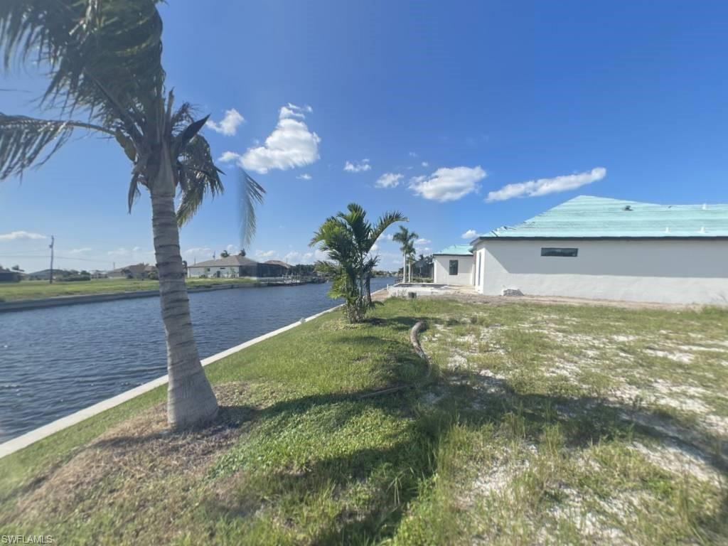 Right Side from middle of seawall on OVERSIZE SOUTHERN rear Exposure Gulf Access lot with NEW (12/2021) 121' SEAWALL - BIG WATER VIEWS