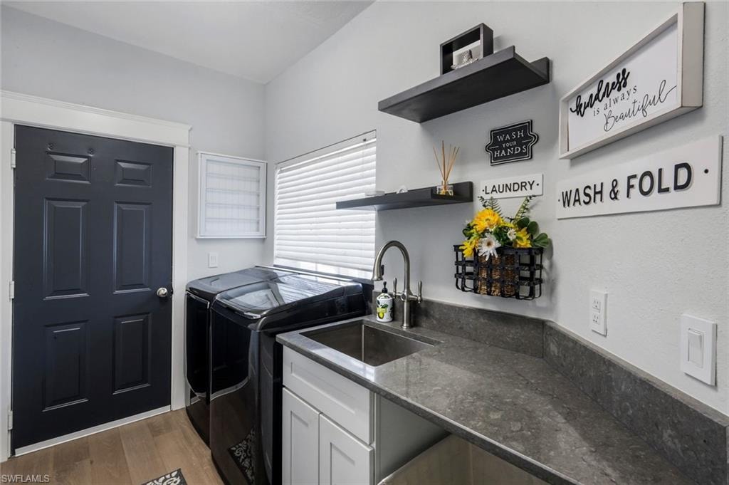 Washer, dryer, Laundry sink & folding area.