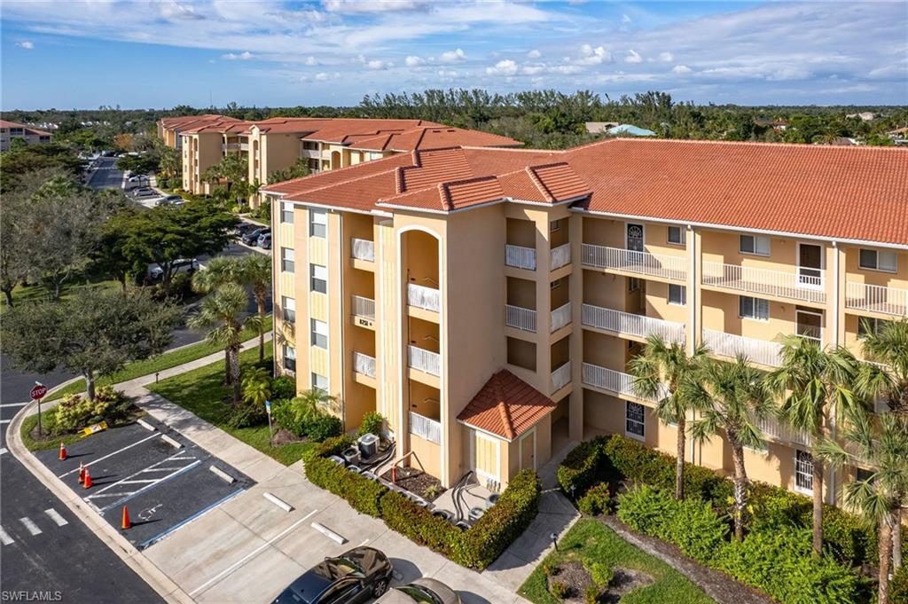 Multi-story residential buildings with terra cotta tile roofs