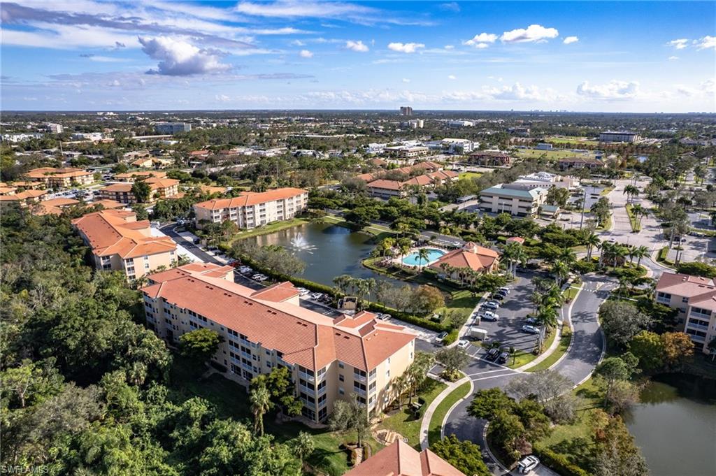Aerial overview of a multi-building residential complex featuring terracotta-tiled roofs