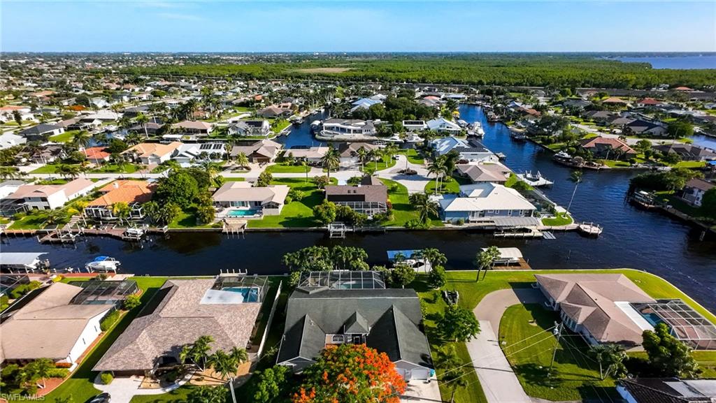 Aerial view of residential area featuring a large body of water