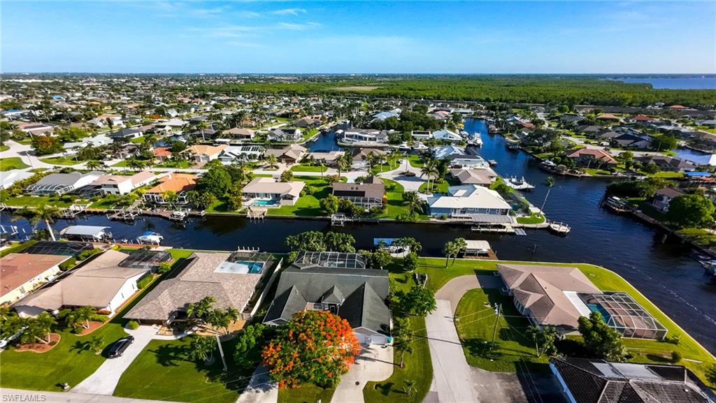 Aerial view of residential area with a nearby body of water
