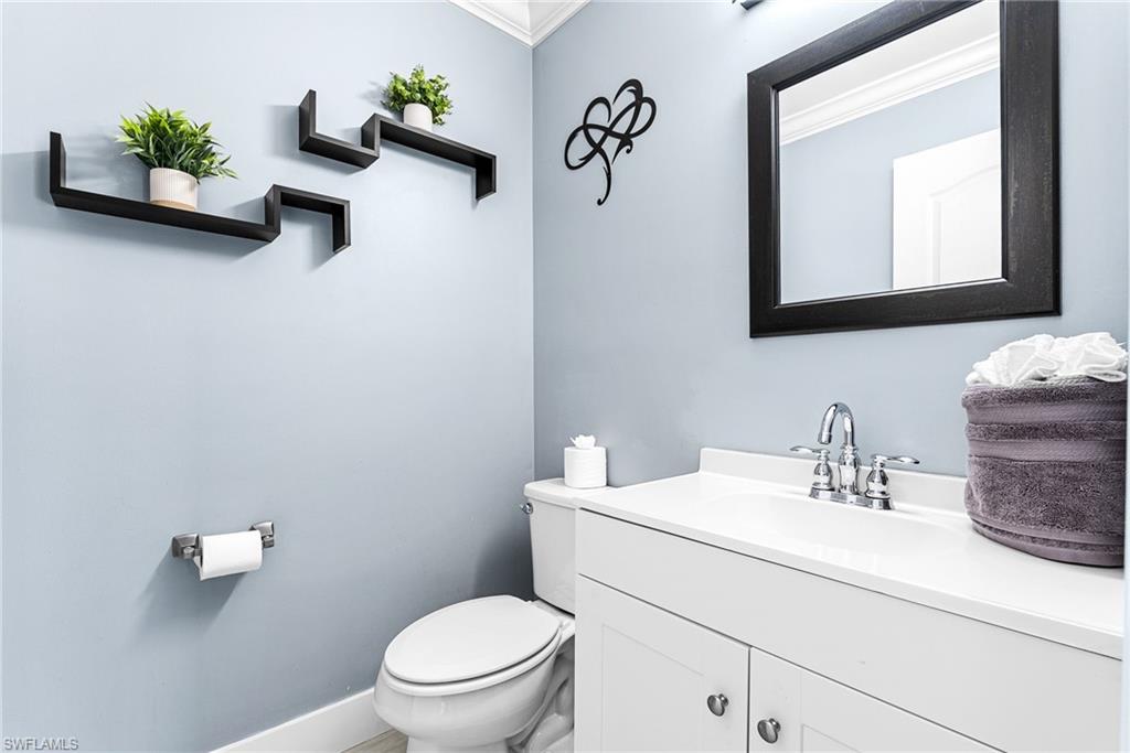 Bathroom featuring vanity and crown molding