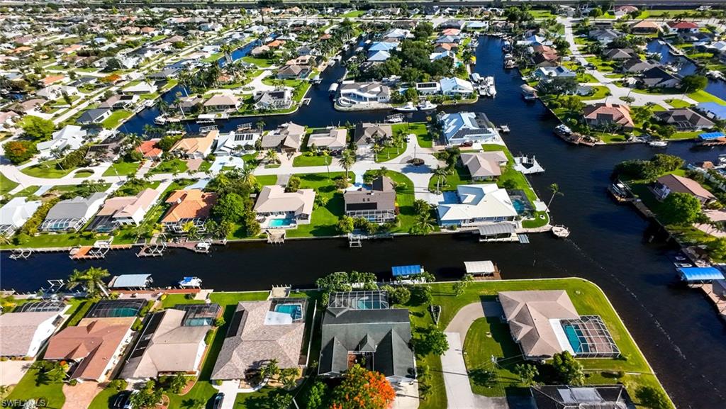 Aerial overview of property's location featuring nearby suburban area and a nearby body of water