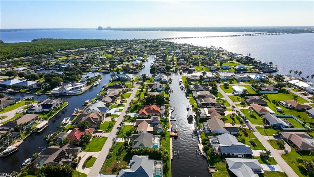 Aerial perspective of suburban area featuring a large body of water
