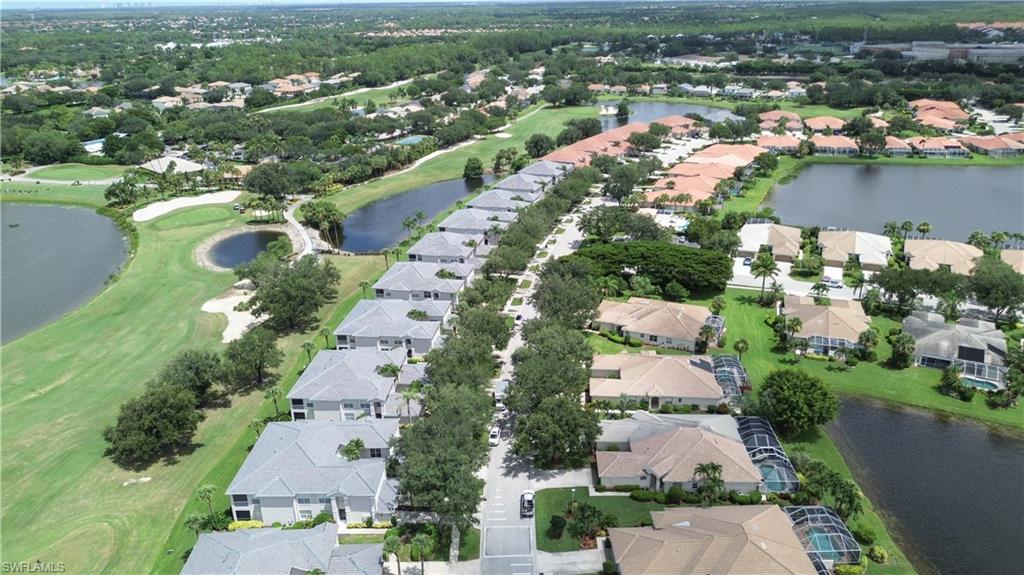 View of property location with nearby suburban area and a large body of water
