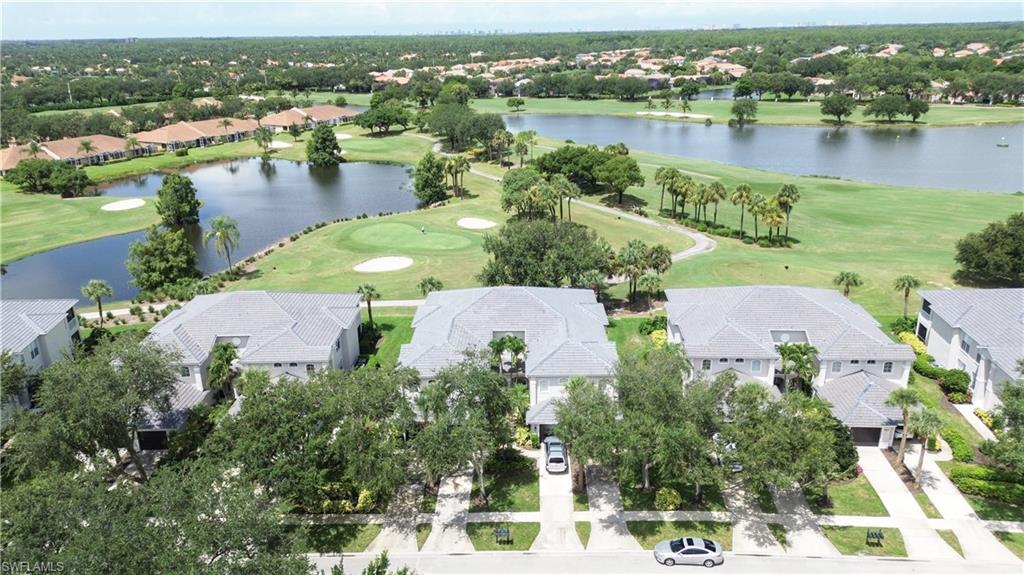 View of property location featuring a golf club and nearby suburban area