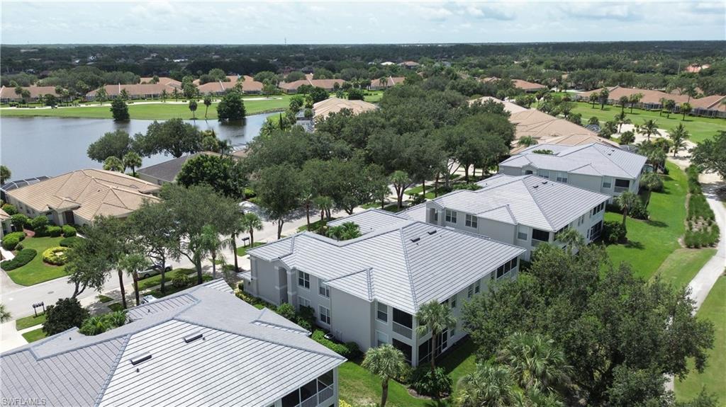 Aerial perspective of suburban area with a large body of water
