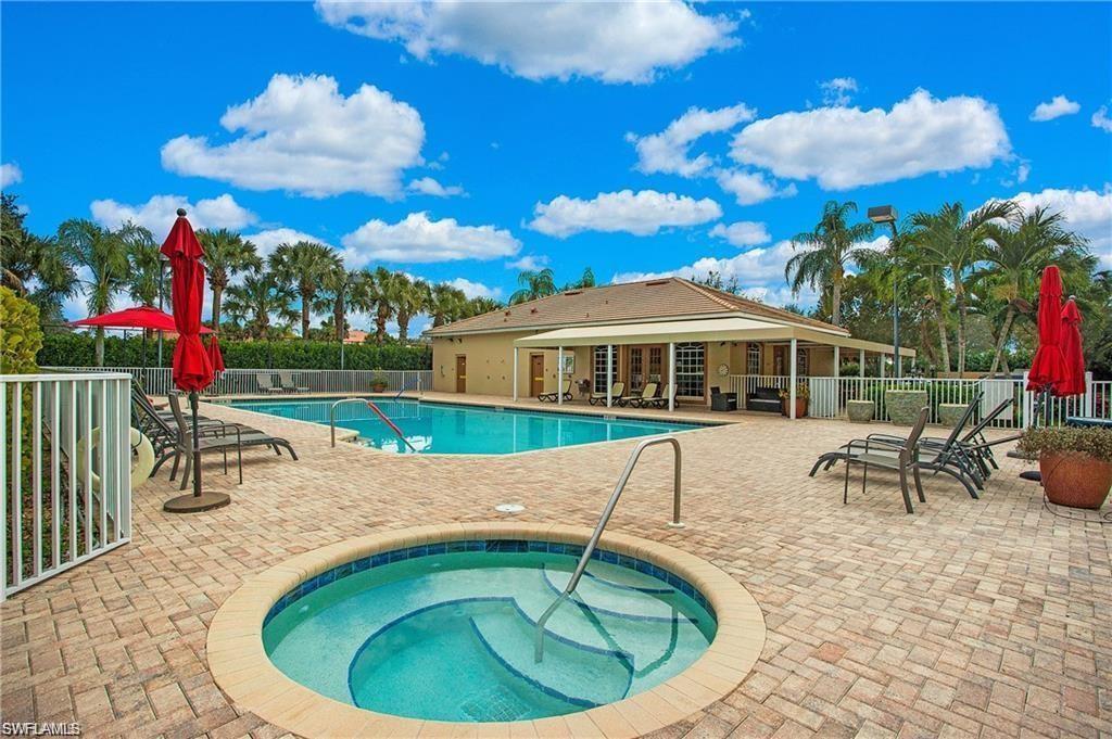 Community pool with a hot tub and a patio