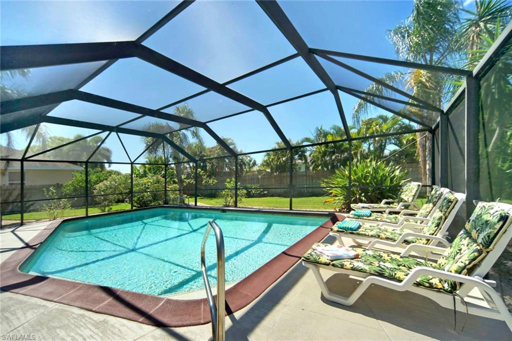 Swimming pool featuring a patio and a lanai