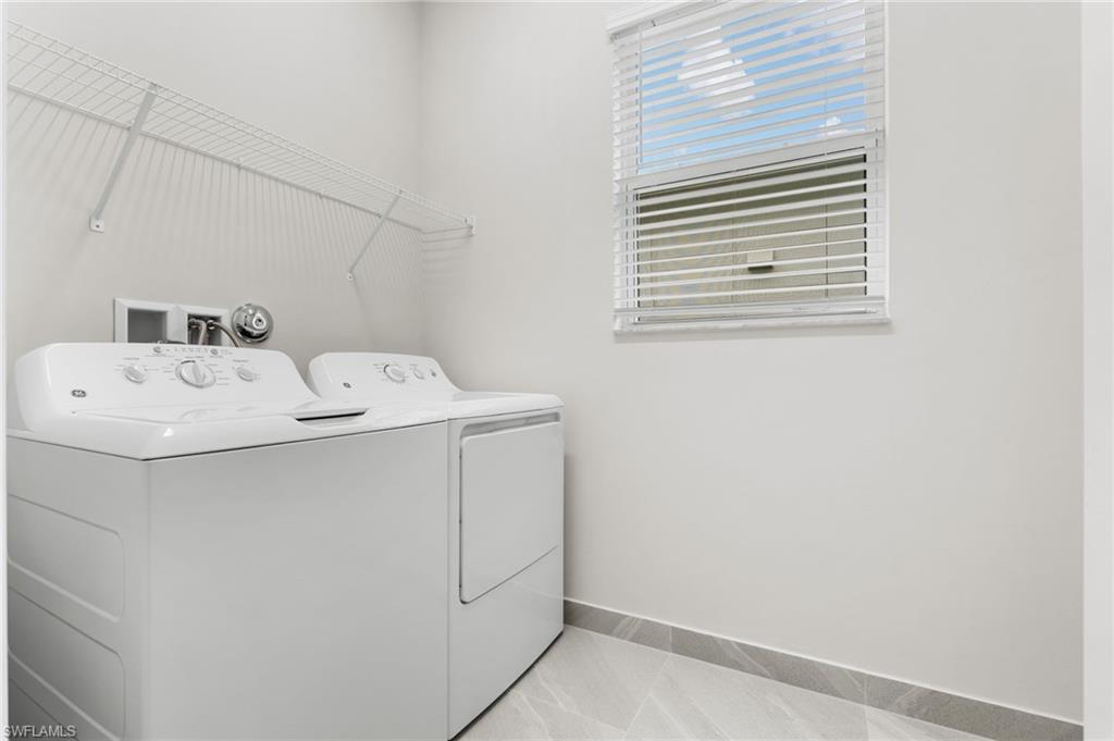 Laundry area featuring washer and dryer, with pre-plumbing for laundry sink.