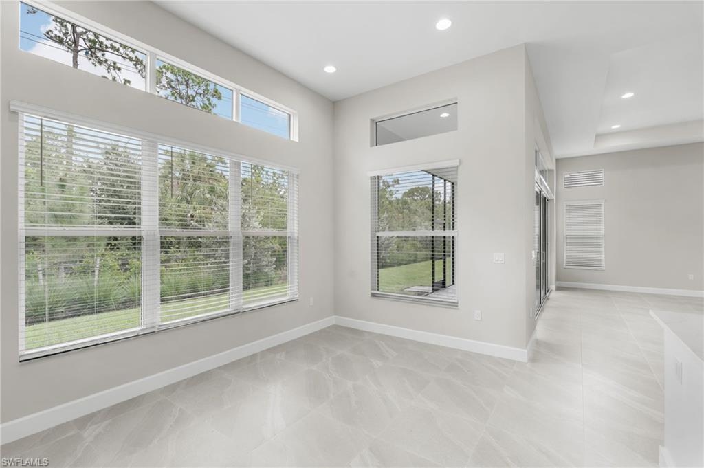 Large dining area with soaring ceilings and transom windows.