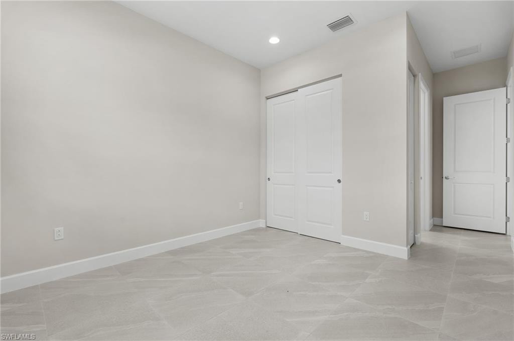 Guest bedroom with recessed lighting, full ensuite bathroom