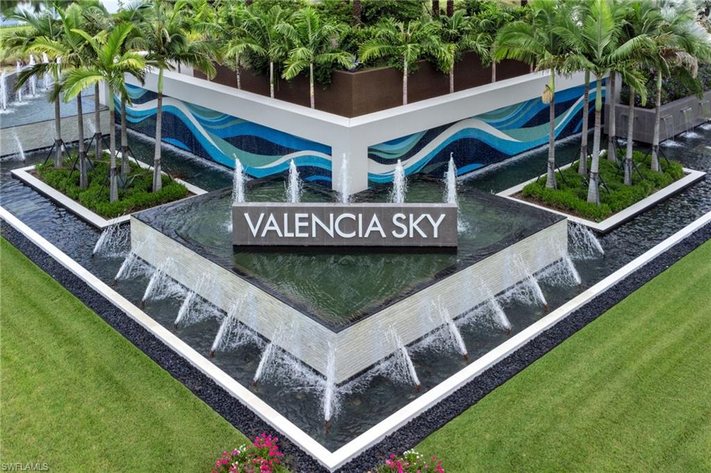 Contemporary front entrance with water feature with multiple fountains
