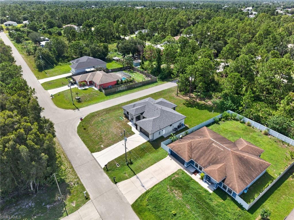Aerial perspective showcasing a residential street with multiple single-story homes