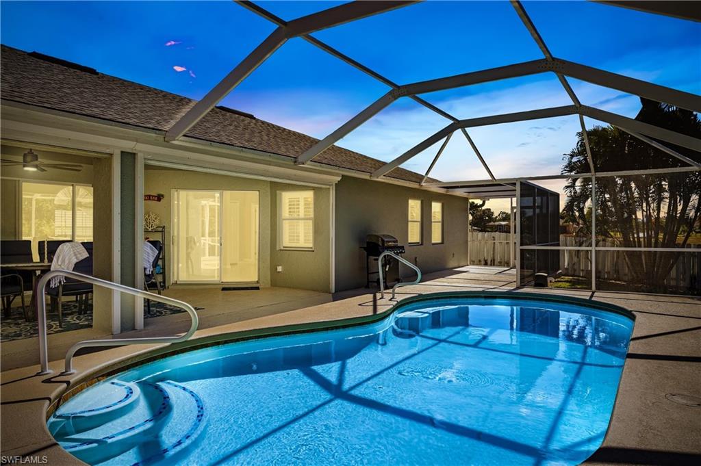 Outdoor pool featuring a patio area, a sunroom, and a lanai