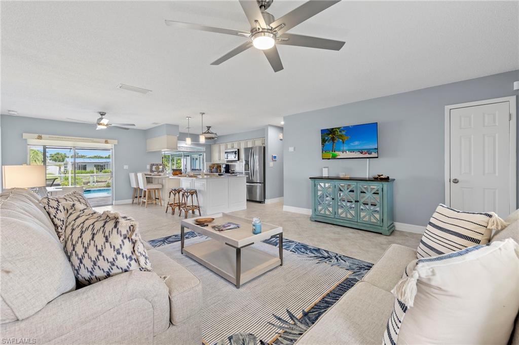Tiled living room with ceiling fan