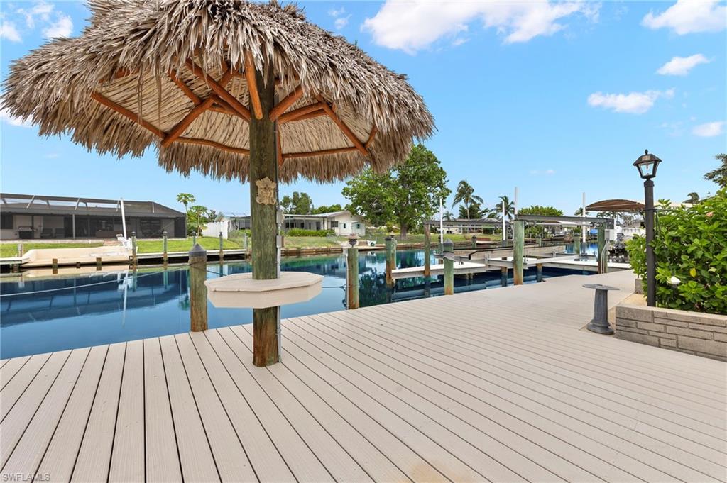 Dock area featuring a lanai and a water view