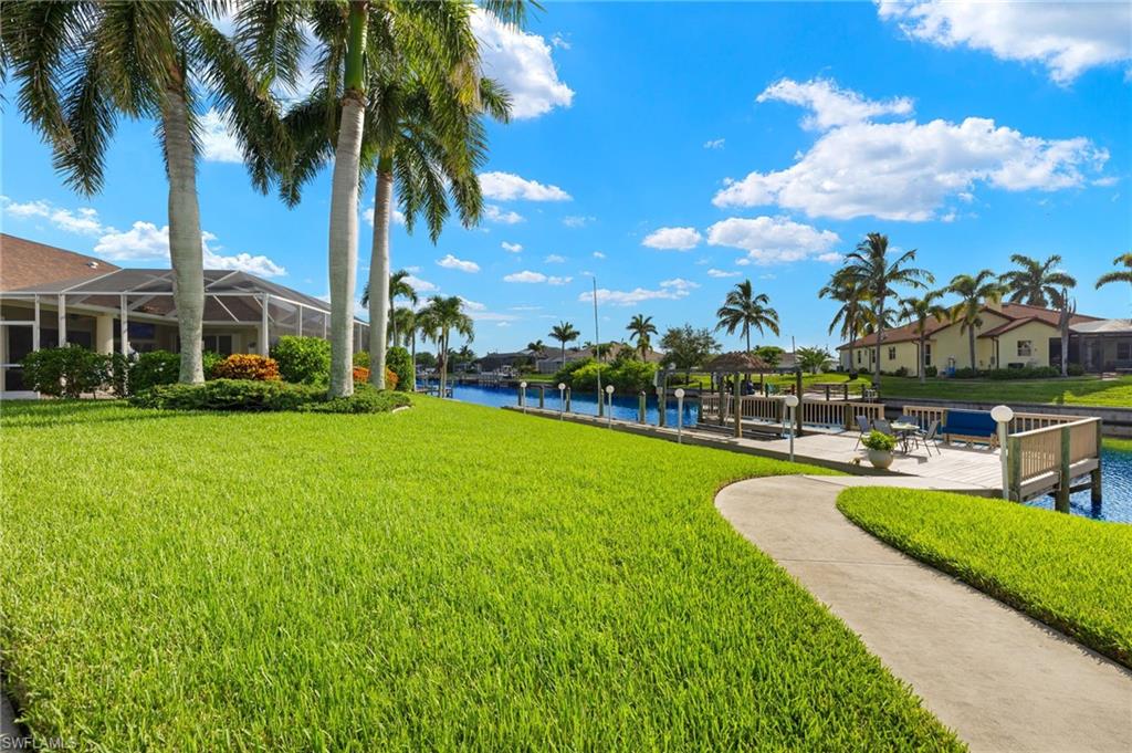 Dock area with seating and plush lawn