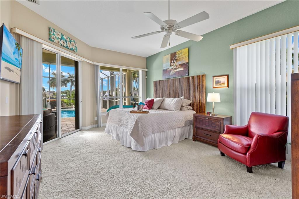 Bedroom with access to outside, ceiling fan