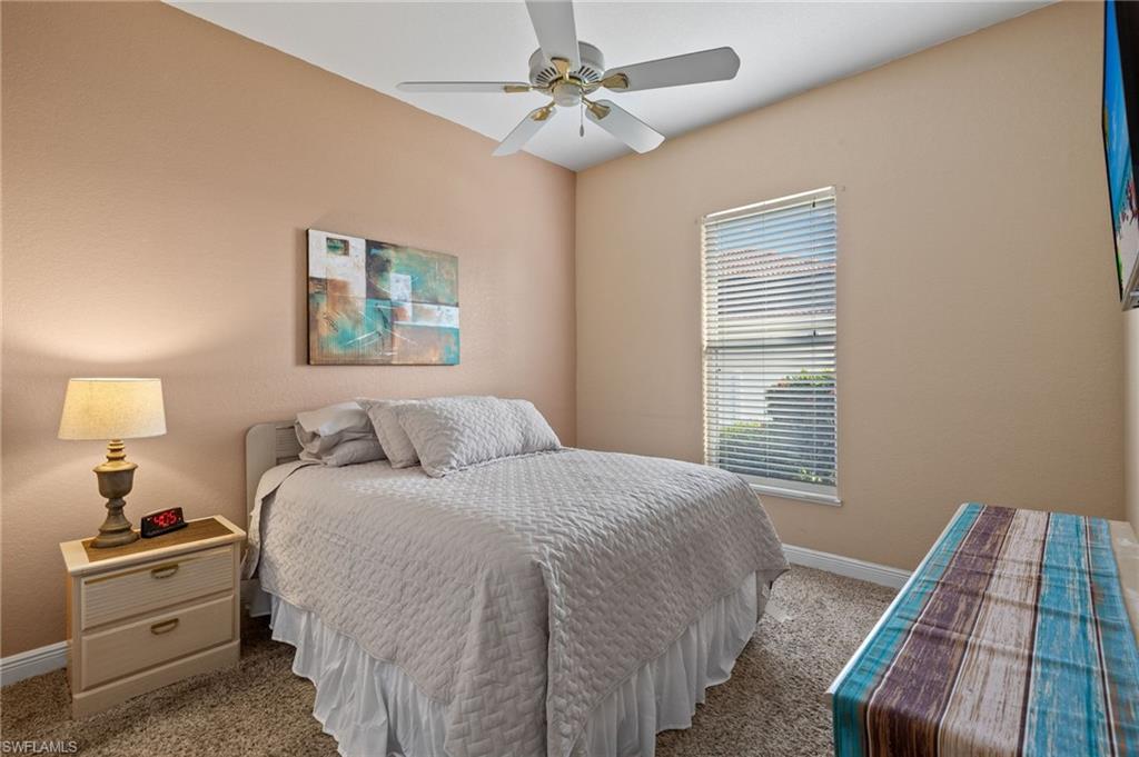 Bedroom featuring ceiling fan and light colored carpet