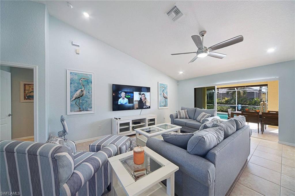 Living room w/ flatscreen tv and ample seating