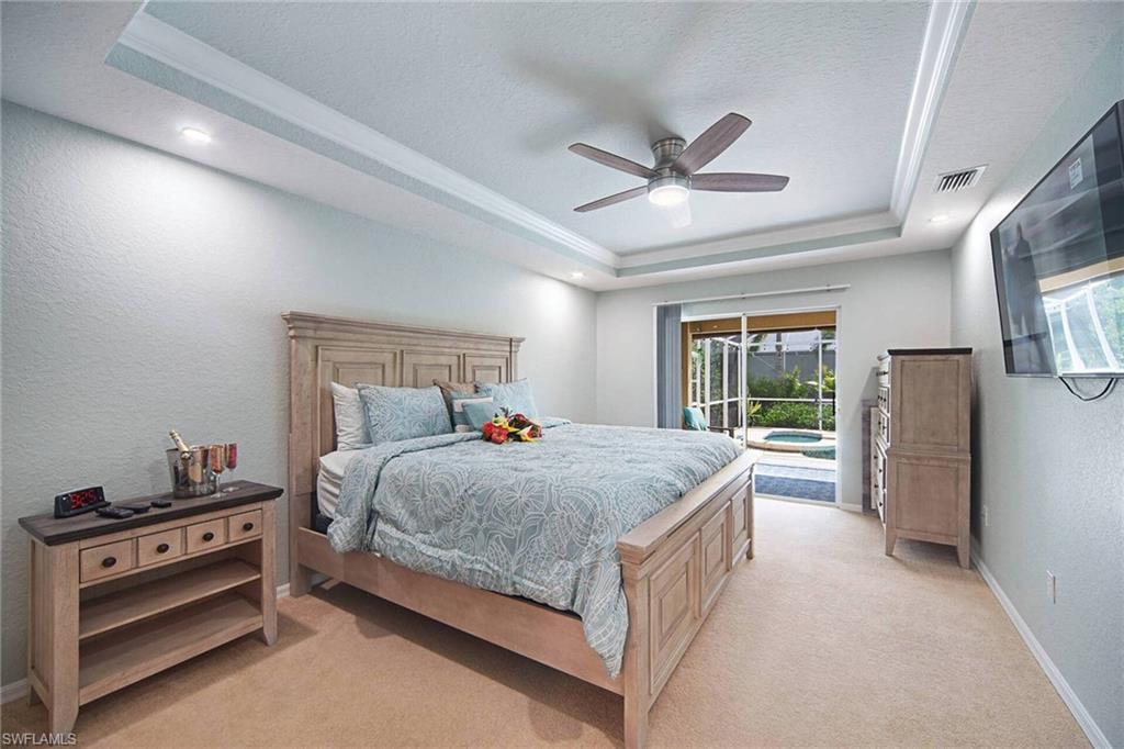 Primary Bedroom w/ view of the pool
