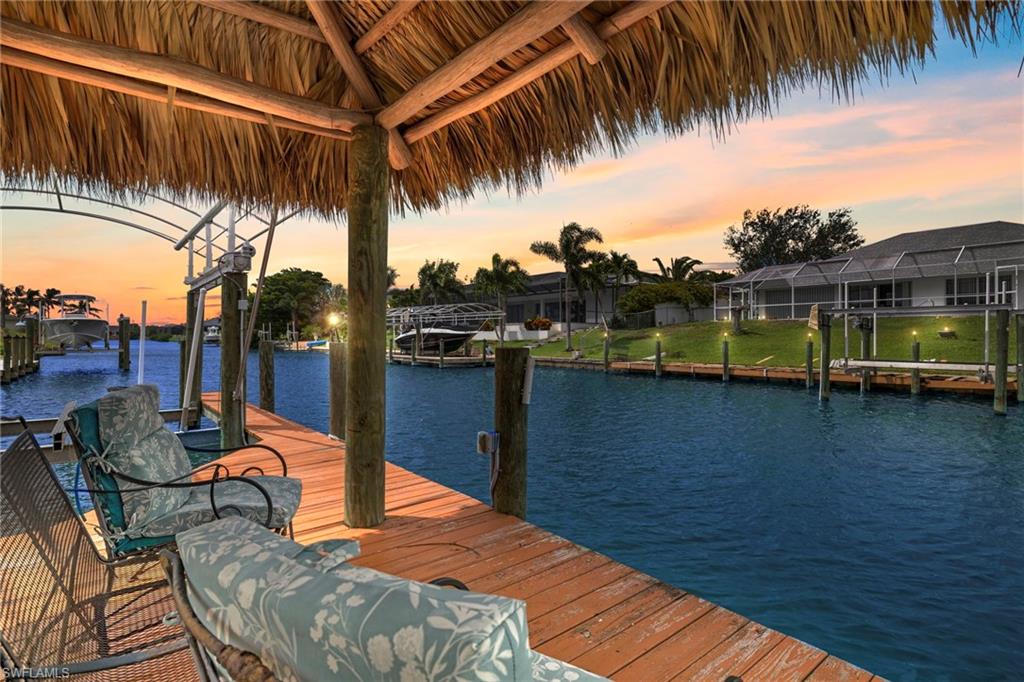 Dock featuring a water view and boat lift