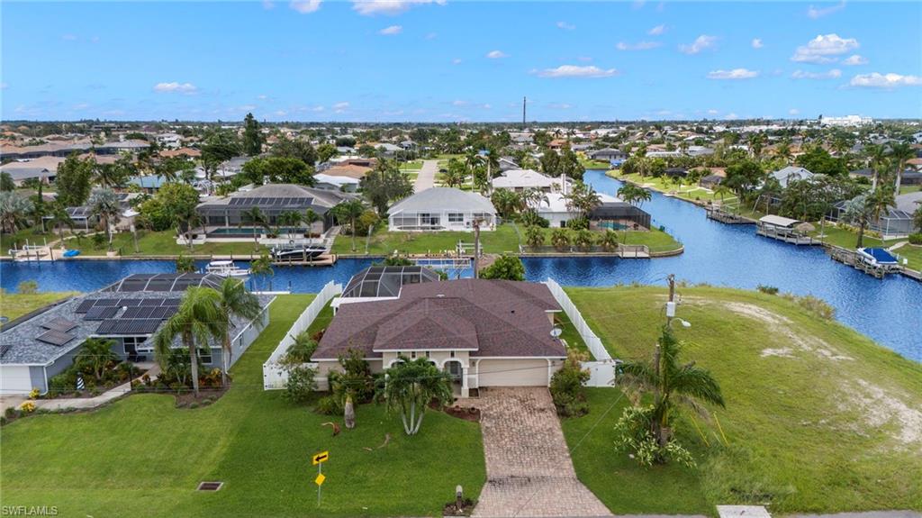 Aerial view of residential area featuring a large body of water