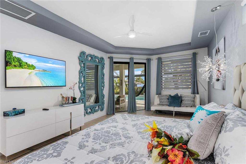 Primary Bedroom w/ flatscreen tv